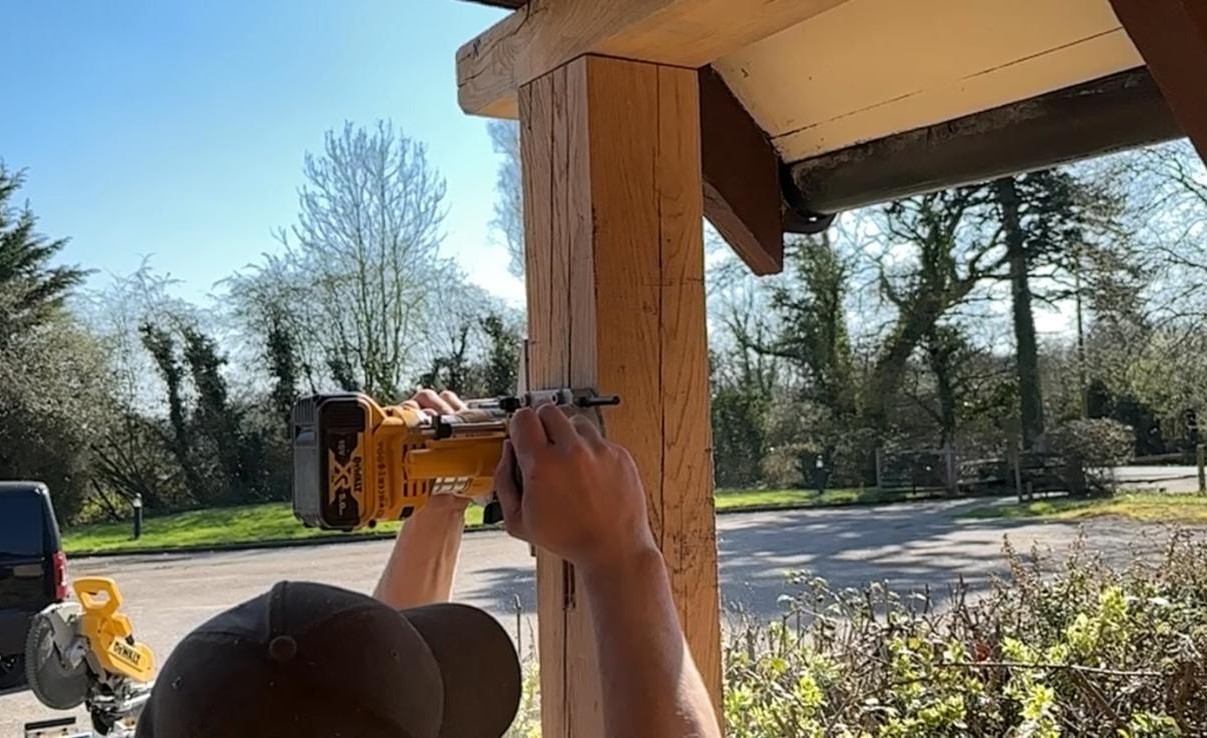 On-site structural work on exposed timber beam
